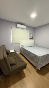 Una cama o camas en una habitación de Residencial Solar das Bromélias 16 fotos más