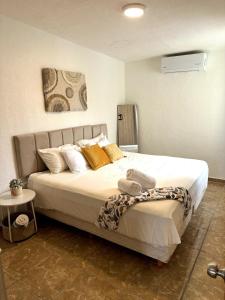 Postel nebo postele na pokoji v ubytování Privada cerca de playa con Jacuzzi, BBQ y Terraza