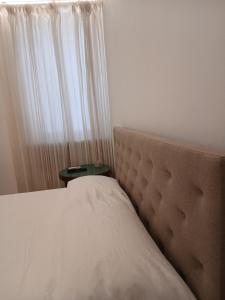 Ένα ή περισσότερα κρεβάτια σε δωμάτιο στο La casa di Ambrogio - Novara