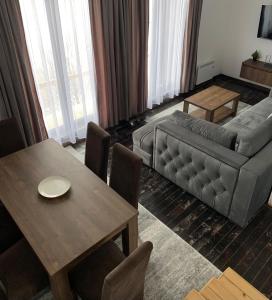 a living room with a couch and a table at Spiky hill resort in Kopaonik