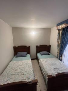 Ένα ή περισσότερα κρεβάτια σε δωμάτιο στο La muñeca Chalet