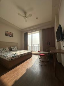 Ένα ή περισσότερα κρεβάτια σε δωμάτιο στο Paradise stay