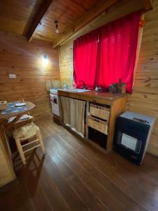 Η κουζίνα ή μικρή κουζίνα στο Cabaña "mainimbu"