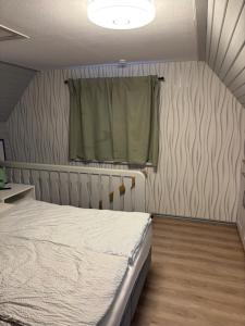 Postel nebo postele na pokoji v ubytování Ferienhaus Talblick, im Luftkurort Finsterbergen + 31 fotografií