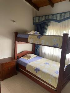 Ένα ή περισσότερα κρεβάτια σε δωμάτιο στο La muñeca Chalet +18 φωτογραφίες