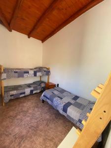 En eller flere senge i et værelse på Dúplex Las Malvinas