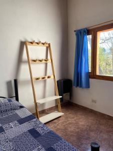 En eller flere senge i et værelse på Dúplex Las Malvinas