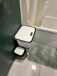 a small bathroom with a toilet and a sink at Welcome to Dovas Home in Anykščiai