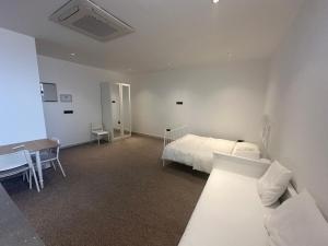 Ένα ή περισσότερα κρεβάτια σε δωμάτιο στο شقة رقم 2