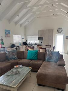 a living room with a couch and a table at The Dunes in Yzerfontein