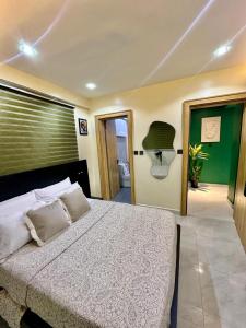 Ένα ή περισσότερα κρεβάτια σε δωμάτιο στο Forest apartment wuse ll