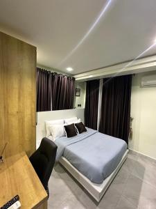 Ένα ή περισσότερα κρεβάτια σε δωμάτιο στο Forest apartment wuse ll