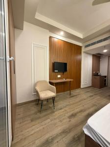 Una televisión o centro de entretenimiento en Paradise stay