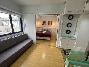 Ένα ή περισσότερα κρεβάτια σε δωμάτιο στο Hotel Ninet Al Lorena Paulista Jardins com garagem cozinha 3107