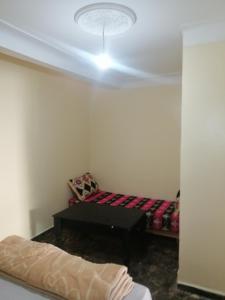 Postel nebo postele na pokoji v ubytování Dar Sofiane