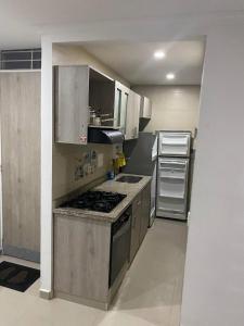 Kuchyň nebo kuchyňský kout v ubytování Acogedor apto familiar, cómodo y bien ubicado