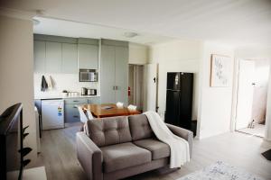 a living room with a couch and a table at Modern Oberon Retreat Close to Lakes & Forests in Oberon