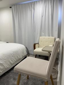 Ένα ή περισσότερα κρεβάτια σε δωμάτιο στο Rayann Hospitality