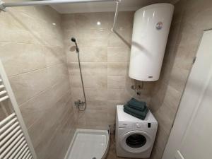 Koupelna v ubytování Ravana Sky Apartments + 31 fotografií