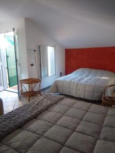 Postel nebo postele na pokoji v ubytování Villino Ida