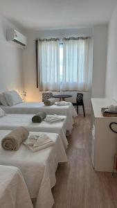 Ένα ή περισσότερα κρεβάτια σε δωμάτιο στο Maravilha