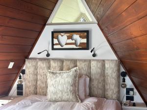 a room with a bed in a tiny house at Southern Cross Guesthouse in Somerset West