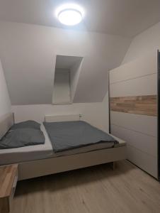 Postel nebo postele na pokoji v ubytování Samast Apartment