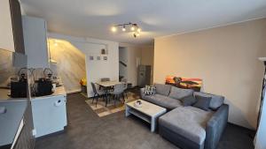 a living room with a couch and a table at Geluk in Bettingen in Bettingen