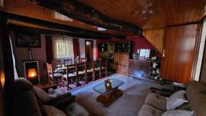a living room with a couch and a table at Villa Tojo in Touro