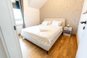 Ένα ή περισσότερα κρεβάτια σε δωμάτιο στο Vrdnik Residence Apartments 33