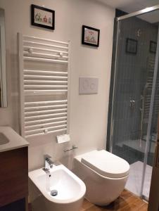 a bathroom with a toilet and a sink and a shower at Erbanova in Sila in Camigliatello Silano +40 photos
