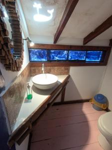 a bathroom with a sink and a toilet at cozy studio in Máncora +10 photos