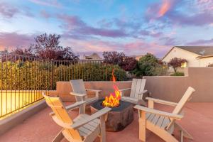 a patio with chairs and a fire pit at 3BD-2BA Heated Pool & Spa Fire-pit BBQ Billiards in Sedona