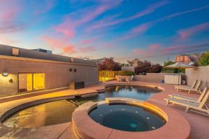 a backyard with a swimming pool and a house at 3BD-2BA Heated Pool & Spa Fire-pit BBQ Billiards in Sedona +65 photos