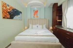 Ένα ή περισσότερα κρεβάτια σε δωμάτιο στο Welcome to Kaniz Furnished Apartment