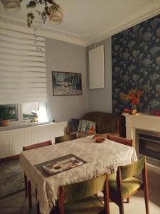 a living room with a table and a couch at Dom otwarty in Jelenia Góra