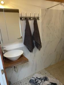 a bathroom with a sink and a mirror at Casita Ricarda in Tazacorte +29 photos