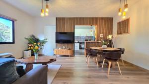 a living room with a couch and a table at The North Paradise - Porto Moniz in Porto Moniz