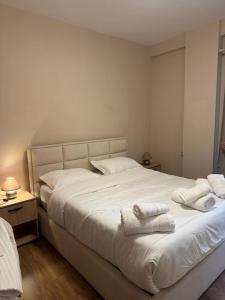 Ένα ή περισσότερα κρεβάτια σε δωμάτιο στο Aurora Apartament