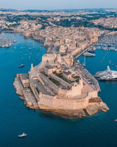 an aerial view of the city of dubrovnik on the water at Traditional Maltese home in the three cities in Cospicua