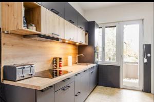 a kitchen with white cabinets and a counter top at Worms City Apartment in Worms
