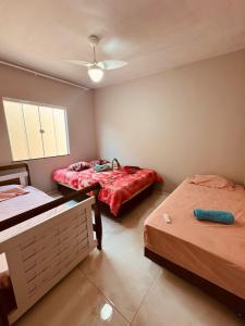 Postel nebo postele na pokoji v ubytování Casa de Praia Unamar + 9 fotografií