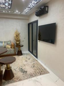 TV a/nebo společenská místnost v ubytování Bel appart proche de la plage + 7 fotografií