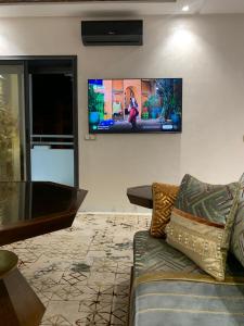 TV a/nebo společenská místnost v ubytování Bel appart proche de la plage