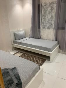 Postel nebo postele na pokoji v ubytování Bel appart proche de la plage