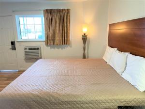 Ένα ή περισσότερα κρεβάτια σε δωμάτιο στο Budget Inn Giddings