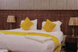 Postel nebo postele na pokoji v ubytování فندق بسمة الوحدة