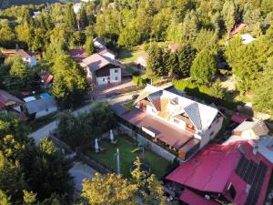an overhead view of a house with a train station at La Neamțu in Văliug