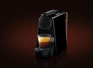 a black coffee maker with a glass of coffee at Dog-friendly Seaview Apartment in Dungarvan