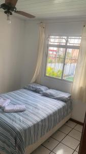 Postel nebo postele na pokoji v ubytování Pousada Pedra da Caveira